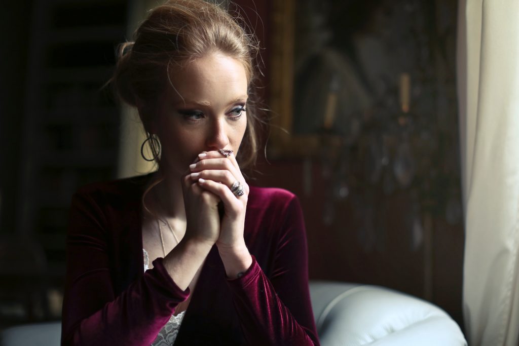 Worried Woman Thinks Of Lung Cancer Diagnosis From Elevated Radon Levels Milwaukee Radon Mitigation & Testing (414) 292-9495